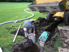 TDSs crew member makes sure that the Catch Basin is level.