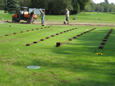 This catch basin was installed on the top end of the system to prevent surface water from flooding the green.