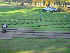 Precise surveys of the grounds are taken to determine the optimum drainage plan.