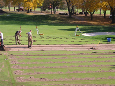 TDS crew prepares greens for the installation of perforated pipes.