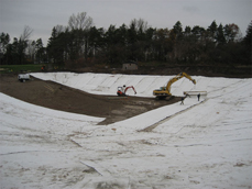 Bentonite liner is fitted to irrigation pond site.