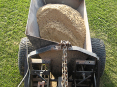 Sand hopper used to top up trenches.