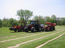 Excess sand being applied and removed after installation is complete.